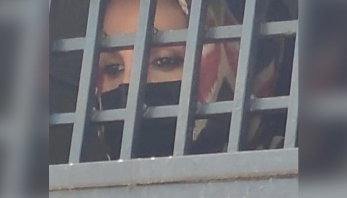 Designer Khadija Shah is brought to an anti-terrorism court in Lahore on May 24, 2023. — Twitter/@AmalSyed1