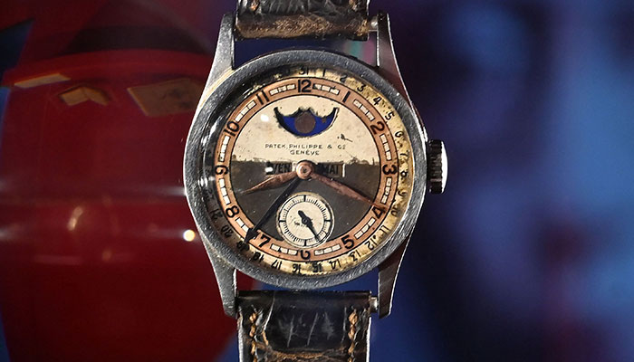 The Patek Philippe Ref 96 Quantieme Lune timepiece once owned by Aisin-Gioro Puyi, the Chinese Qing dynastyâ€™s last emperor (R), is seen on display in Hong Kong on May 23, 2023, ahead of its auction in the territory on the same day.—AFP