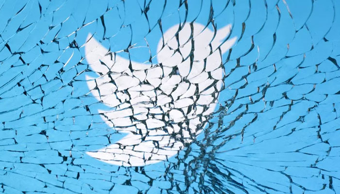 Twitter logo is seen through broken glass in this illustration taken, on January 25, 2023. —Reuters