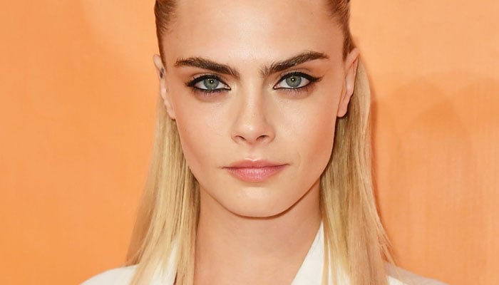 The editor-in-chief of Vogue Anna Wintour also made an appearance and posed with Cara