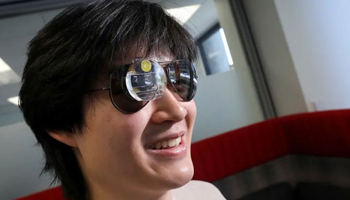 Bryan Chiang, a 22-year-old computer science major and aspiring start-up creator, wears an augmented reality eyepiece equipped with RizzGPT in San Francisco, California, US, on May 11, 2023. Reuters