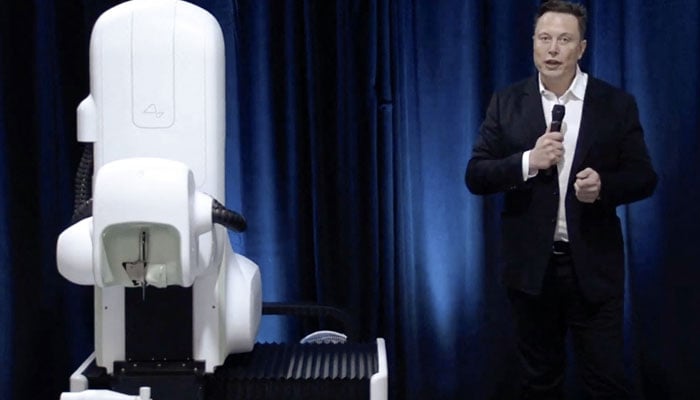 This Neuralink Livestream shows Elon Musk standing next to the surgical robot during his Neuralink presentation on August 28, 2020. — AFP