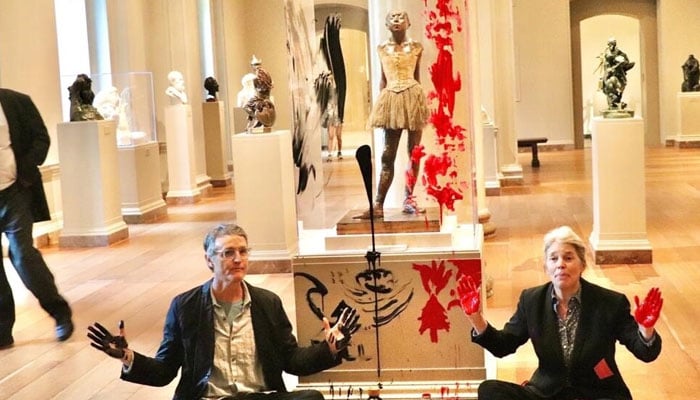 Timothy Martin (L) and Joanna Smith (R) have been arrested for an attack on a Degas sculpture at the National Gallery of Art. —AFP