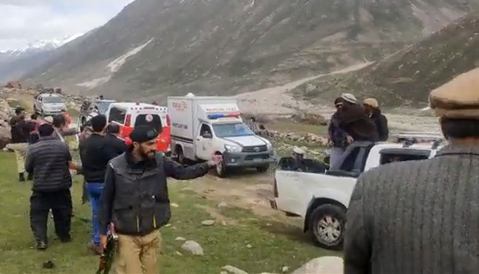 Rescue officials search for the avalanche victims in the Astore district in Pakistan’s northern Gilgit-Baltistan on May 27, 2023, in this still taken from a video. — Twitter/iAliTajGB