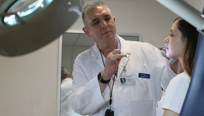 A Mexican plastic surgeon examines a patient at the Bucio Surgicenter clinic in Tijuana, Baja California, Mexico. — AFP