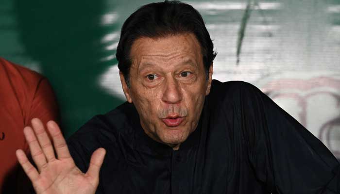 PTI chief Imran Khan speaks to media representatives at his residence in Lahore on May 18, 2023. — AFP