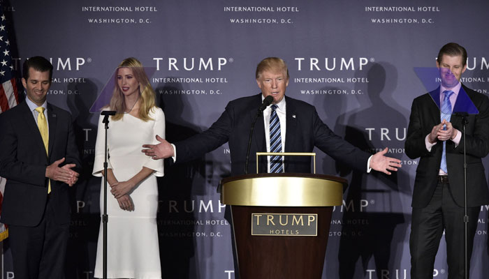 This photo shows Donald Trump, with his children (L-R) Donald Trump Jr, Ivanka Trump, and Eric Trump, during the grand opening of the Trump International Hotel in Washington, DC. — AFP/File