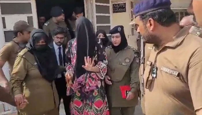 PTI supporter Khadija Shah being taken by police from the courtroom on May 24, 2023, in this still taken from a video. — YouTube/Screengrab/Geo News