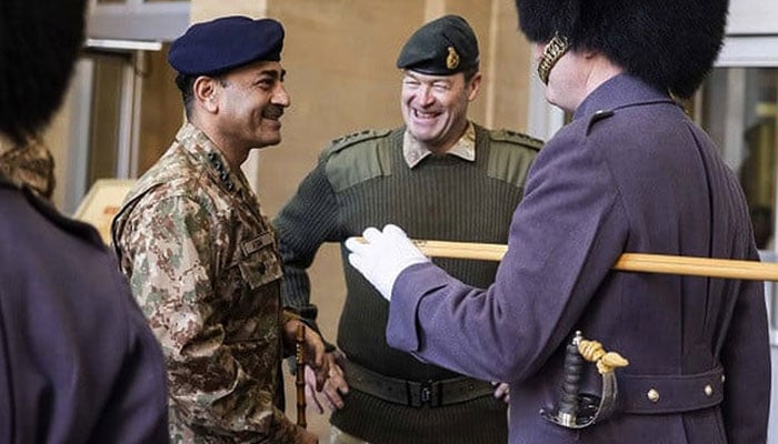 In this photo, taken on February 12, 2023, British Army Chief of General Staff General Sir Patrick Sanders (right) gestures to British Army Chief of Staff General Asim Munir in London.  — Twitter/@PakFauj