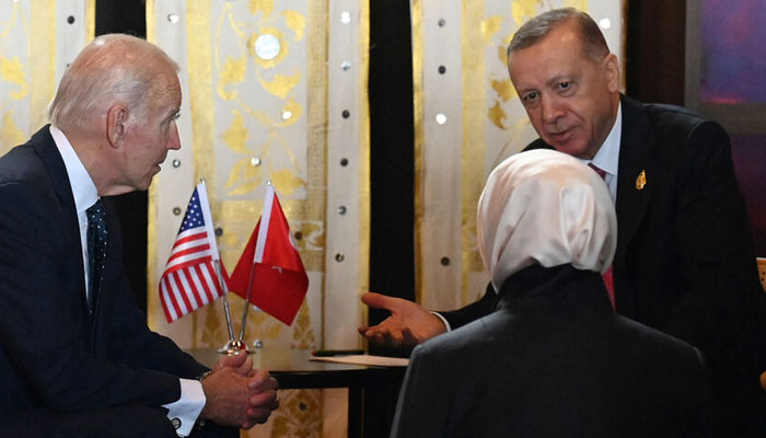 US President Joe Biden (L) talks with Turkeys President Recep Tayyip Erdogan (R) and an intrepreter during their bilateral meeting during the G20 summit in Nusa Dua on the Indonesian resort island of Bali on Nov. 15, 2022. AFP