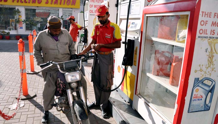 Fuel station worker filling petrol in a motorbike at a fuel station in Hyderabad on January 29, 2023. — PPI