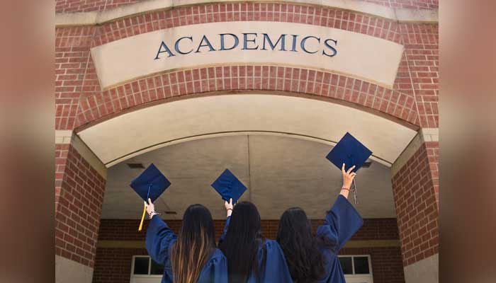 Students pose at their graduation. — Unsplash