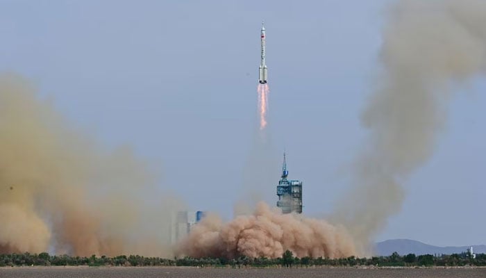 A Long March-2F carrier rocket, carrying the Shenzhou-16 spacecraft and three astronauts, takes off from the launching area of Jiuquan Satellite Launch Center for a crewed mission to Chinas Tiangong space station, near Jiuquan, Gansu province, China May 30, 2023. — Reuters