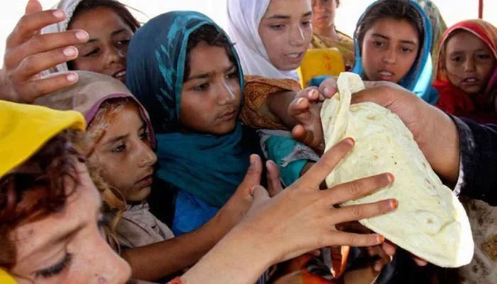 Hunger striken children are trying to get a roti (bread) in this representational image. — AFP/File