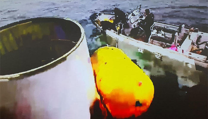 This photo taken on May 31, 2023, shows an object presumed to be part of North Koreas claimed Space Launch Vehicle being salvaged by South Koreas military. — AFP