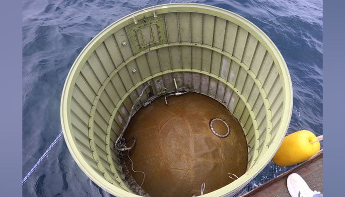 This photo taken on May 31, 2023, shows an object presumed to be part of North Koreas claimed Space Launch Vehicle being salvaged by South Koreas military in waters 200km (124 miles) west of Eocheong Island in the Yellow Sea. — AFP