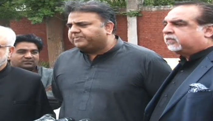 Former Pakistan Tehreek-e-Insaf leader Fawad Chaudhry (centre) addresses the press conference outside Adiala jail on May 31, in this still taken from a video. — YouTube/Geo News/Live