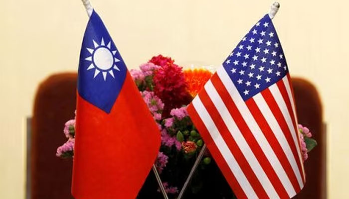 Flags of Taiwan and the US are placed for a meeting in Taipei, Taiwan March 27, 2018. —Reuters