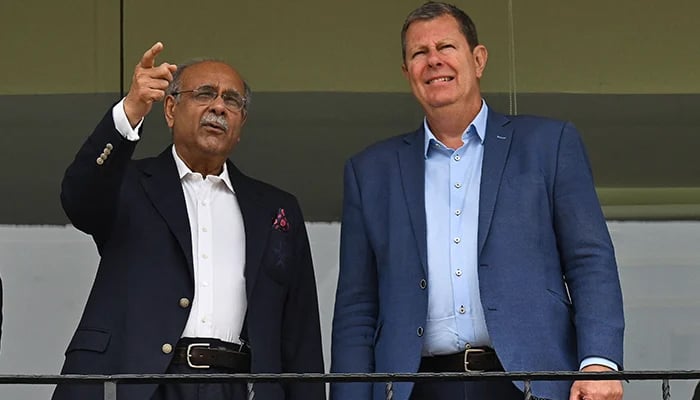 International Cricket Council (ICC) Chairman Greg Barclay (right) visits the Gaddafi Stadium along with Pakistan Cricket Board Chairman (PCB) Najam Sethi (left) in Lahore on May 30, 2023. — AFP