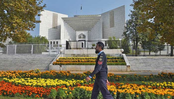 A policeman walks past   the Supreme Court gathering  successful  Islamabad successful  this undated photograph  — AFP/File