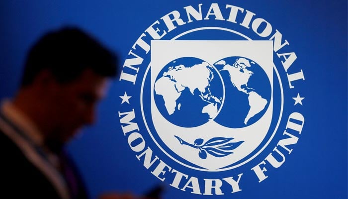 A participant stands near a logo of IMF at the International Monetary Fund - World Bank Annual Meeting 2018 in Nusa Dua, Bali, Indonesia, October 12, 2018. — Reuters