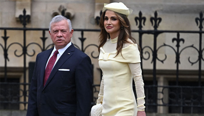 Jordans King Abdullah II Ibn Al Hussein and Jordanias Queen Rania arrive at Westminster Abbey in central London on May 6, 2023. — AFP