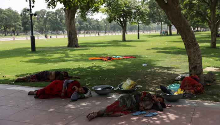 Women labourers take rest under a tree, on a hot summer day near India Gate, in New Delhi, India May 15, 2023. —Reuters