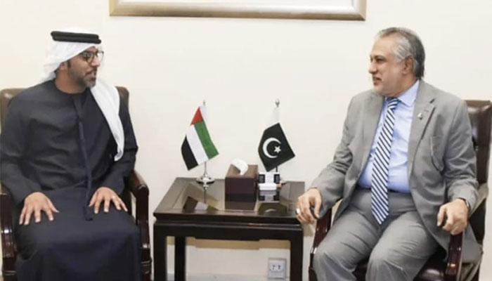 Minister for Finance and Revenue Ishaq Dar (right) speaks to UAE ambassador to Pakistan Hamad Obaid Ibrahim Salim Al-Zaabi in Islamabad on June 1, 2023. — Twitter/@FinMinistryPak