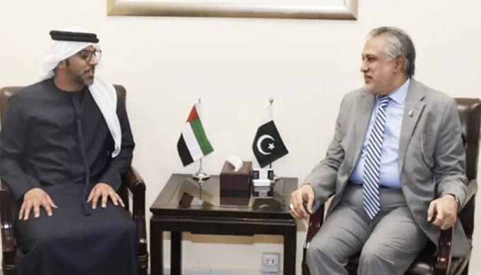 Minister for Finance and Revenue Ishaq Dar (right) speaks to UAE ambassador to Pakistan Hamad Obaid Ibrahim Salim Al-Zaabi in Islamabad on June 1, 2023. — Twitter/FinMinistryPak