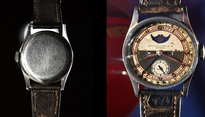 The Patek Philippe Ref 96 Quantieme Lune timepiece once owned by Aisin-Gioro Puyi, the Chinese Qing dynastyâ€™s last emperor (R), is seen on display in Hong Kong on May 23, 2023, ahead of its auction in the territory on the same day.—AFP