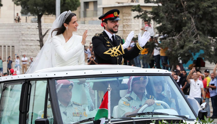 Hussein and Al Saif leave the palace after their royal wedding. [Ahmad Abdo/Reuters]Hussein and Al Saif leave the palace after their royal wedding. —Reuters