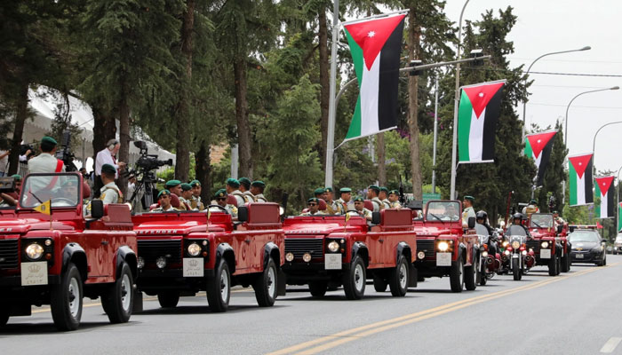 A convoy of royal guards heads towards Zahran Palace. —Reuters