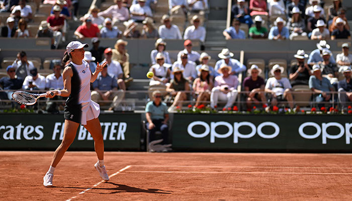 Polands Iga Swiatek plays a forehand return to US Claire Liu during their womens singles match on day five of the Roland-Garros Open tennis tournament at the Court Philippe-Chatrier in Paris on June 1, 2023. AFP