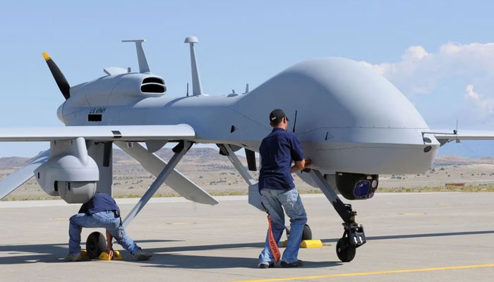 Workers prepare an MQ-1C Gray Eagle unmanned aerial vehicle for static display at Michael Army Airfield, Dugway Proving Ground in Utah. — Reuters/File
