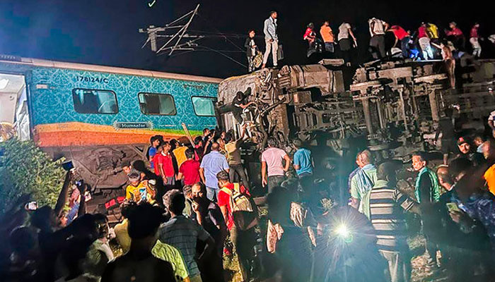 People gathered at the crash site in Odisha state. Press Trust of India