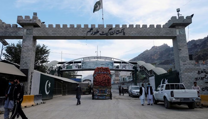 A truck carrying sacks crosses through the post in Torkham, on December 3, 2019. — Reuters