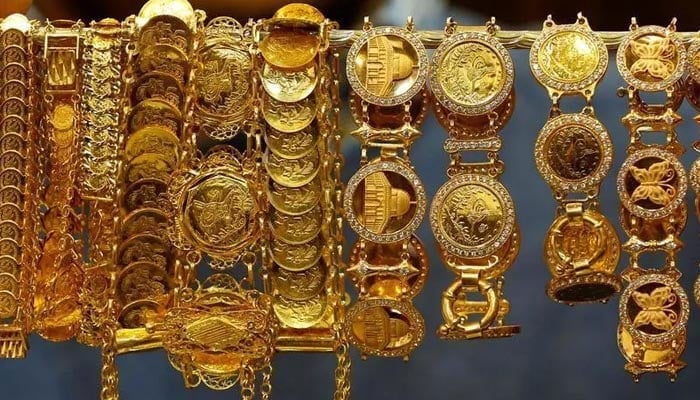 A dealer displays gold bracelets showing the Dome of the Rock mosque at his jewellery shop in Amman, Jordan, December 12, 2017. — Reuters