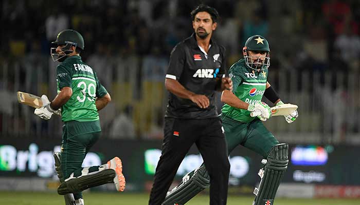 Pakistani batters Babar Azam and Mohammad Rizwan take runs as New Zealand bowler Ish Sodhi looks for the ball amid an ODI match. — AFP/File