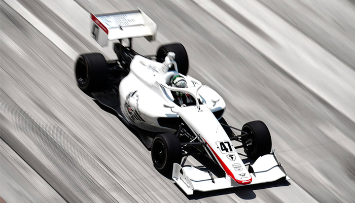 Enam Ahmed driving his racing car.  - Author's photo