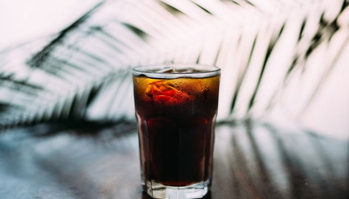 This illustration shows a glass of sugary soda. — Unsplash/File