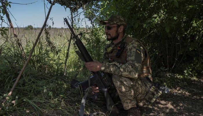 A Ukrainian serviceman looks on near the Ukraine-Russia border, amid Russias attack on Ukraine, in Kharkiv region, Ukraine, June 4, 2023.—Reuters
