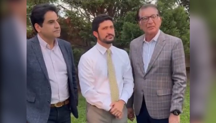 A still taken from a video showing PTI focal person in the US Sajjad Burki (left) US Congressman Greg Casar and PTI worker Atif Khan. — Twitter/@SajjadBurki