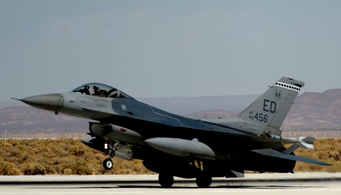 An F-16 fighter jet is seen in the foreground as the space shuttle Endeavour makes a flyby before landing at Edwards Air Force Base in California. — Reuters/File