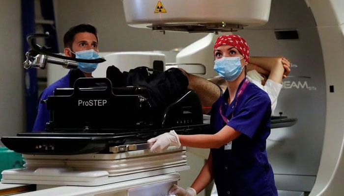 Medical staff performs a stereotactic radiotherapy treatment at the UPMC Hillman Cancer Center San Pietro FBF. — Reuters/File