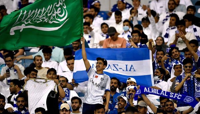 Saudi fans at the Asian Champions League final in Riyadh, where club and national colors mingled.  — Reuters/File