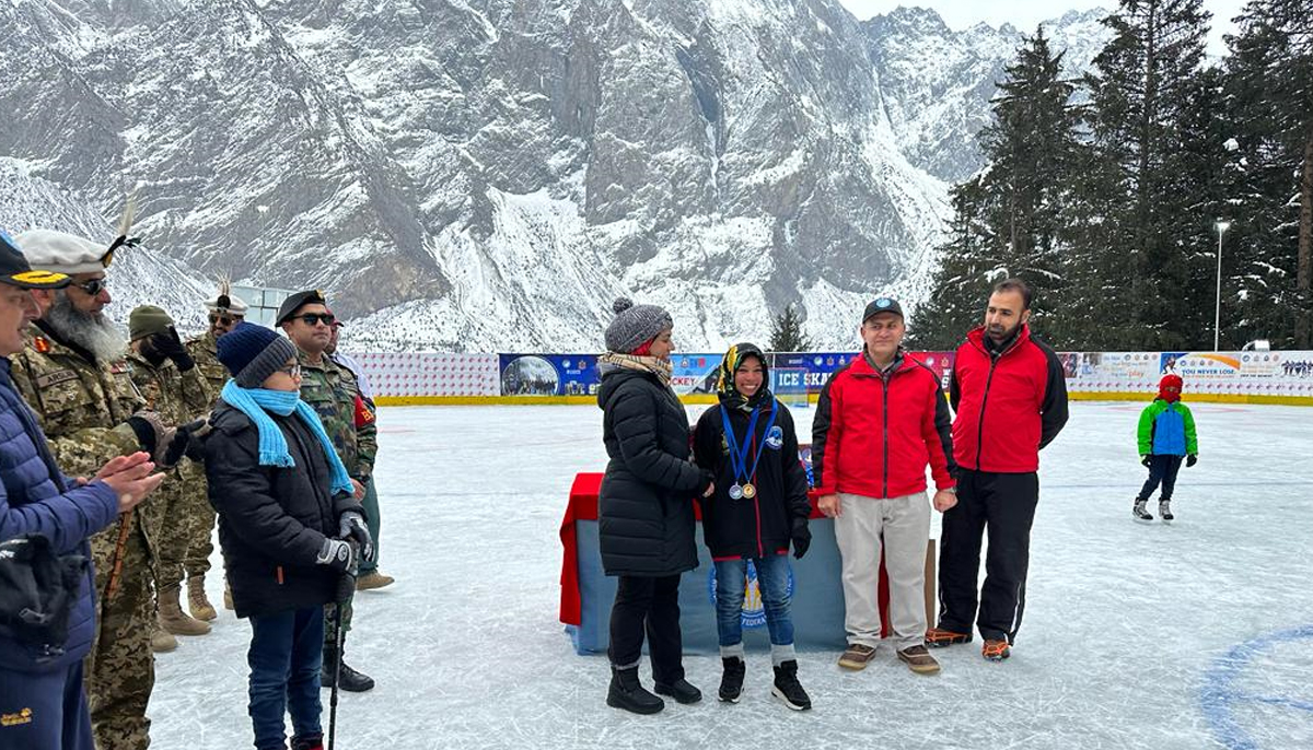 Ramsha Hussain receives two medals for her win during ice games held in the countrys mountainous region. — Photo supplied by author