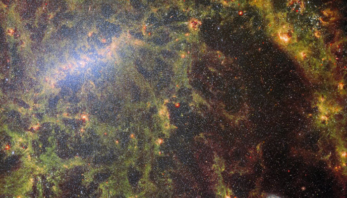 Webb’s composite image released on June 2, 2023, of the barred spiral galaxy NGC 5068, shows its core and part of a spiral arm. Clumps and filaments of dust, represented in a mossy green colour, form an almost skeletal structure that follows the twist of the galaxy and its spiral arm. — Twitter/@NASAWebb