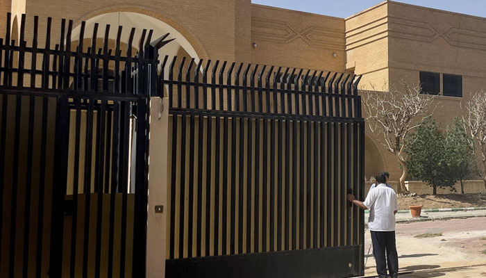 People stand outside the Iranian embassy in Riyadh. — Reuters/File