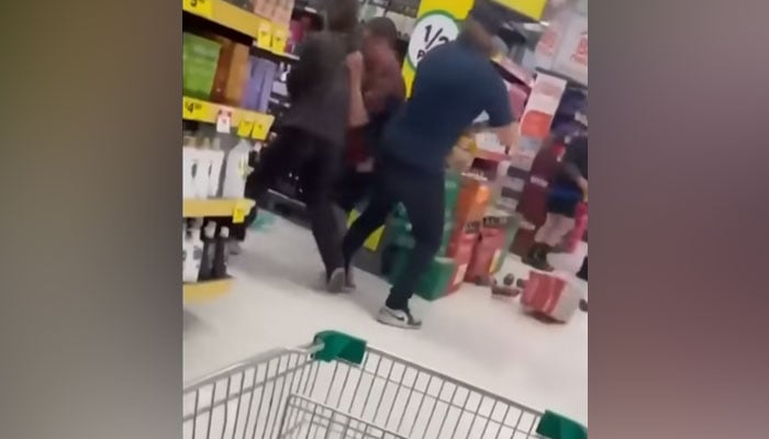 People can be seen embroiled in the fight that took place at an Australian Tamworth Woolworths store in this screen grab taken on June 7, 2023. — YouTube/7NewsAustralia
