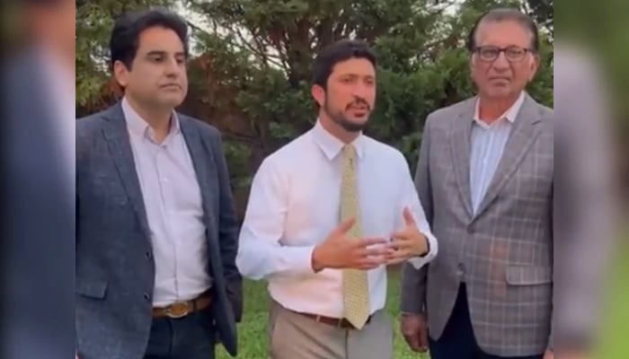 (Left to right) A still taken from a video showing PTI focal person in the US Sajjad Burki, US Congressman Greg Casar and PTI worker Atif Khan. — Twitter/@SajjadBurki